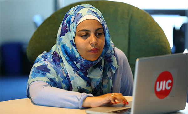 female student looking at laptop