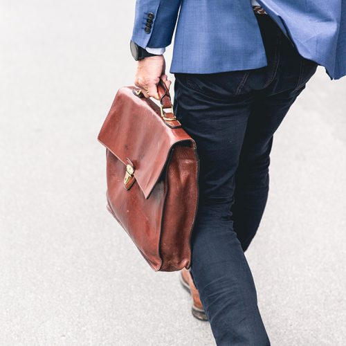 male carrying briefcase
